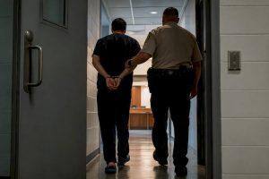 Detainee escorted toward bail hearing